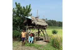 Son and father on field in their farm in India